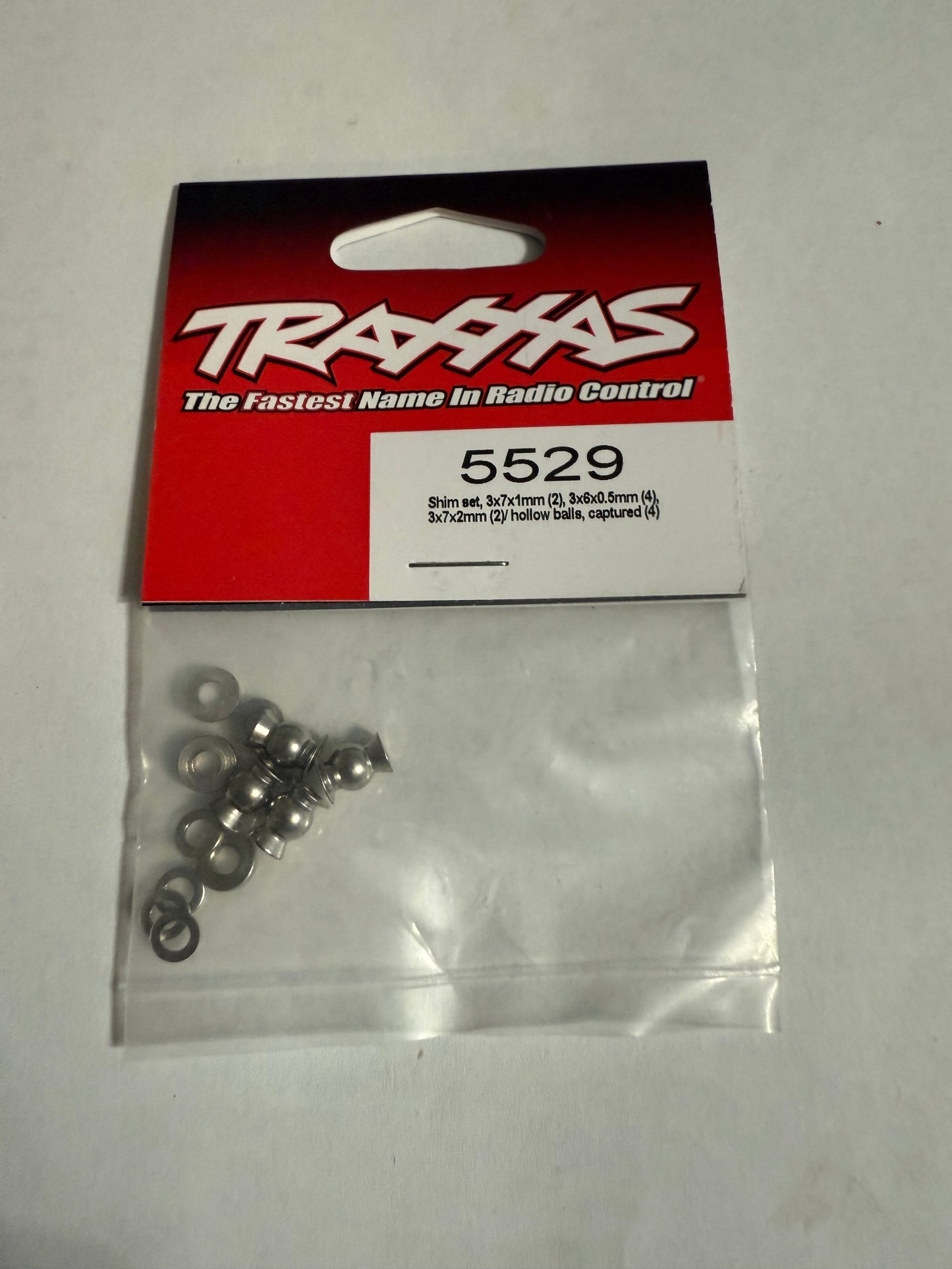 Traxxas 5529  Shim set, 3x7x1mm (2), 3x6x0.5mm (4), 3x7x2mm (2)/ hollow balls, captured (4)